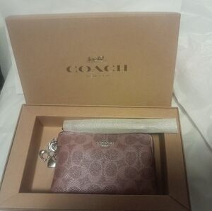 New Coach Wristlet In Matalic Pink Sign.With Charms NWT In Gift Box